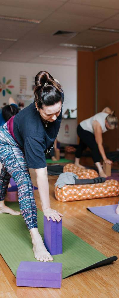 Students learning to become yoga teachers